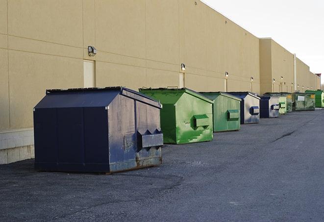 a group of construction workers taking a break near a dumpster in Eden UT